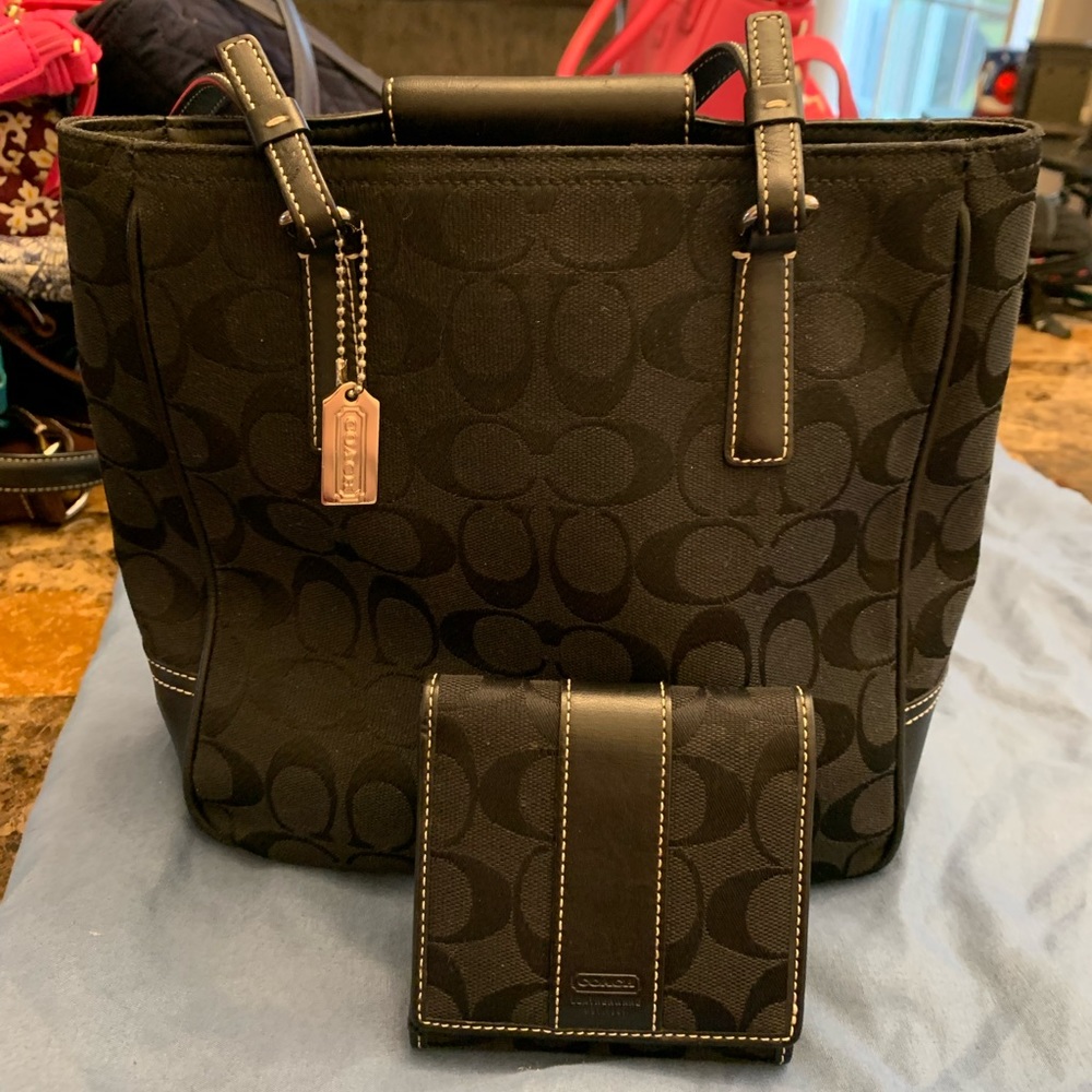 A small Coach tote with matching is wallet